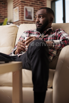 Male freelancer doing remote job at home stock photo NULLED