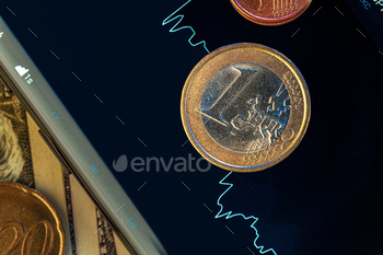 Euro coin on stock chart. Financial investment concept stock photo NULLED