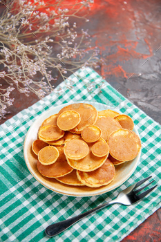 Delicious pancakes and fork on a towel vertical image stock stock photo NULLED