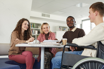 Diverse Group of Students in Library stock photo NULLED