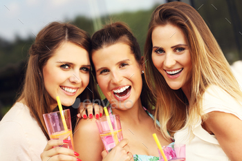 Group of friends with drinks stock photo NULLED