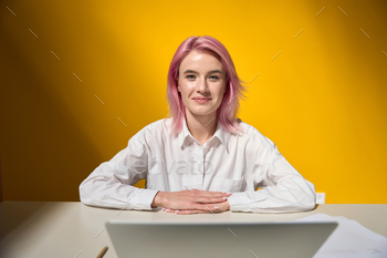 Portrait of young female freelancer at work stock photo NULLED