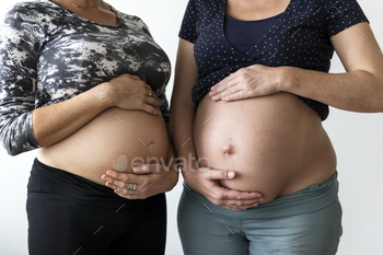 Pregnant women showing their bumps stock photo NULLED