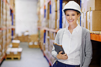 This warehouse is stocked. Shot of a woman at work in a storage warehouse. stock photo NULLED