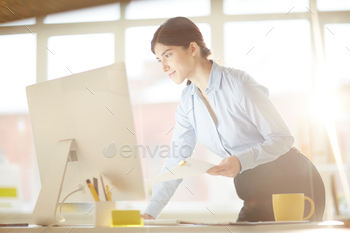Woman by computer stock photo NULLED