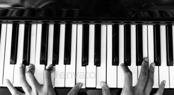 Woman playing on a piano stock photo NULLED