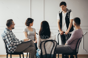 stands in front of a group stock photo NULLED
